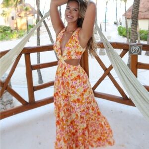 Backless cut out long dress from fortunate one. Pink, yellow, and orange.